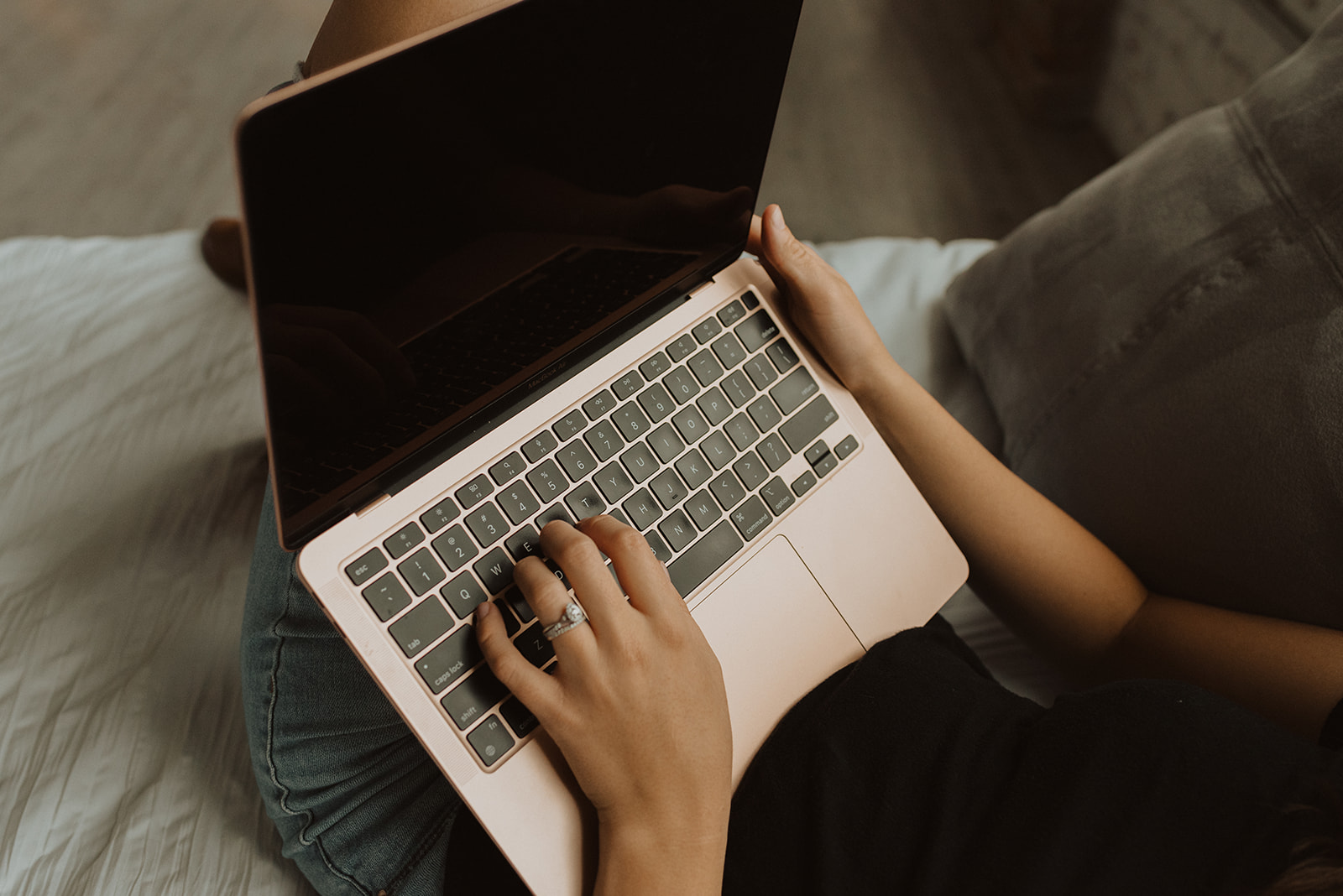 Hands typing on a Macbook Air | Hiring a Copywriter